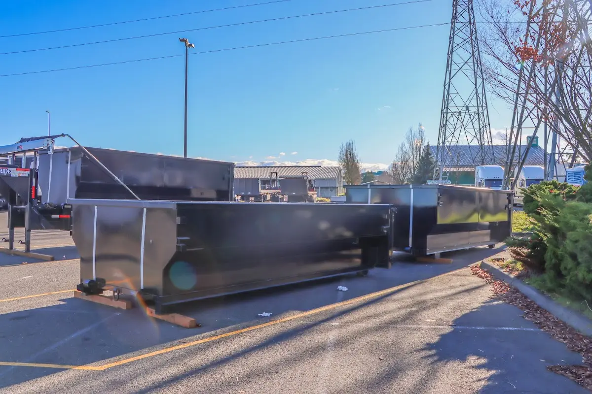 Roll-off dumpster ready for waste disposal at job site for Concrete Dumpster Rental in Bell Gardens